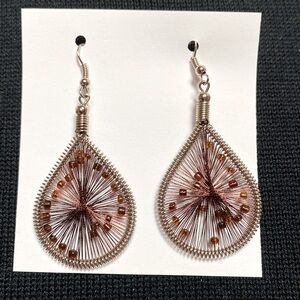 Silver earrings with brown wire design